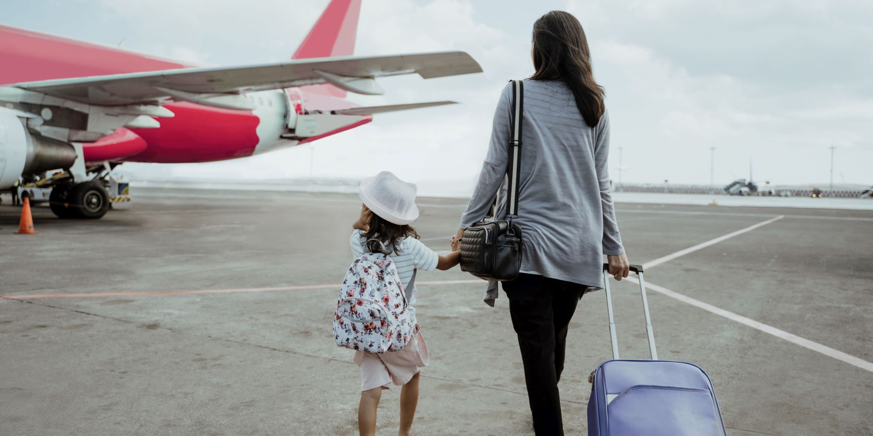 child and parent at airport